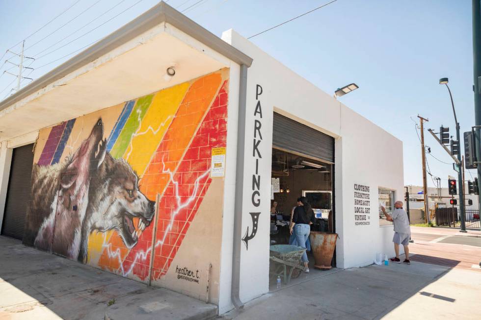 Erik Cerza, owner of I Love Windows cleaning company, cleans the windows at the Good Wolf Lifes ...