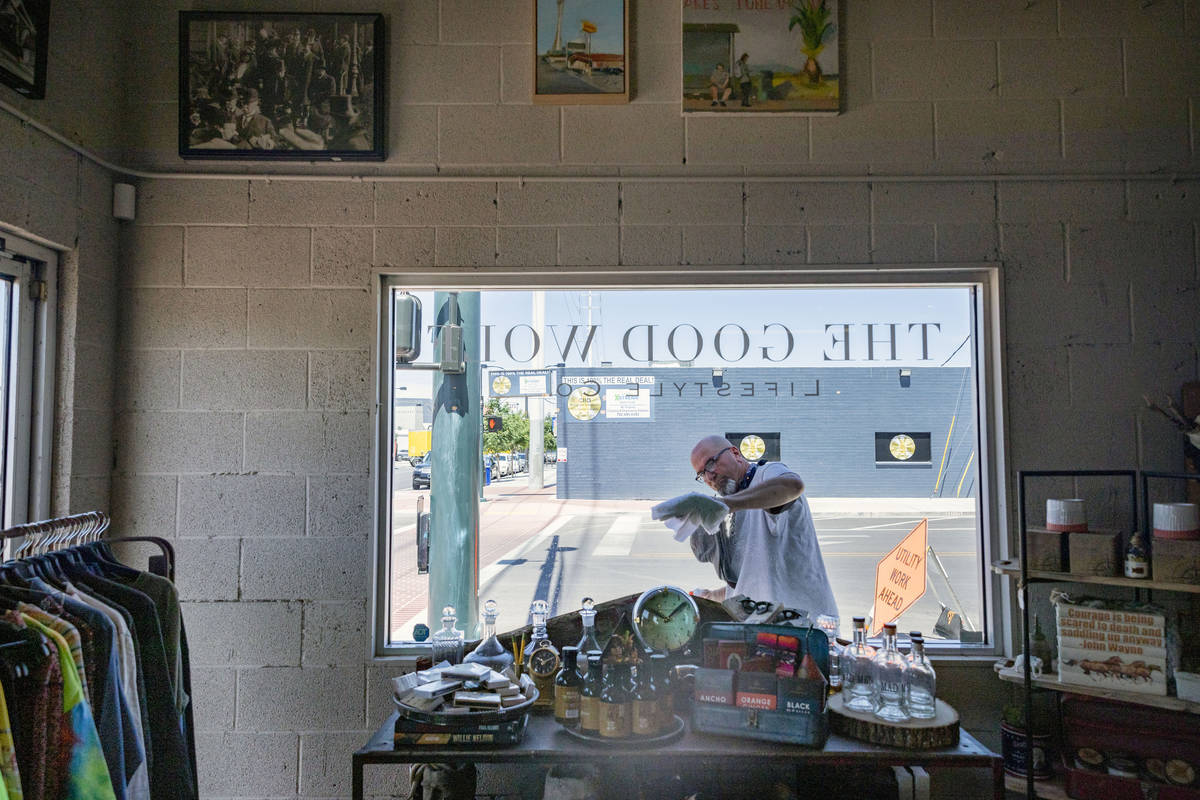 Erik Cerza, owner of I Love Windows cleaning company, cleans the windows at the Good Wolf Lifes ...