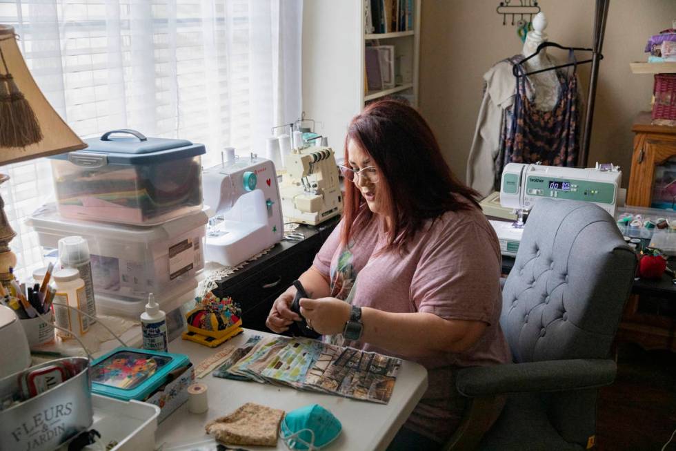 Monica Ursua sews cloth face coverings to donate the earnings to an organization fighting again ...