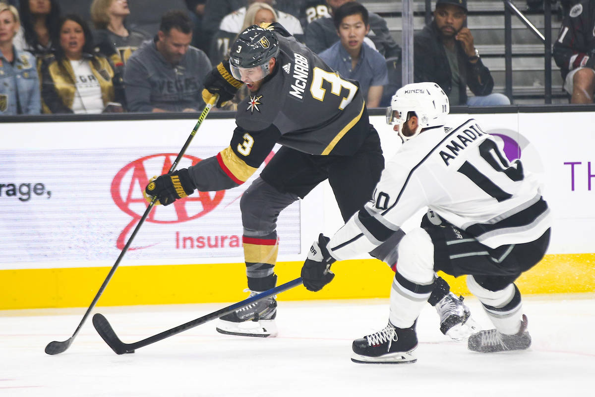 Golden Knights' Brayden McNabb (3) moves the puck around Los Angeles Kings' Michael Amadio (10) ...