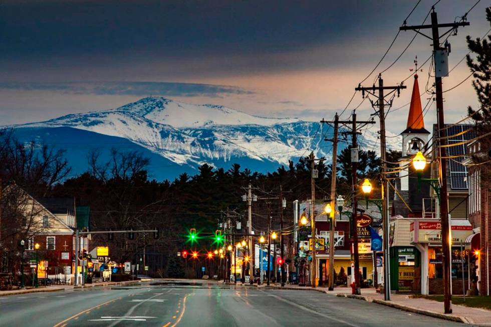 Mt. Washington looms in the distance over scenic North Conway, N.H., where most small shops and ...