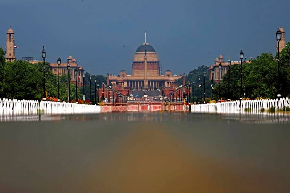 Rajpath, India's ceremonial boulevard is deserted, as India's Presidential Palace is seen durin ...