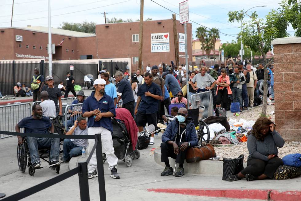 People line up for a meal at Catholic Charities on Foremaster Lane between Las Vegas Boulevard ...