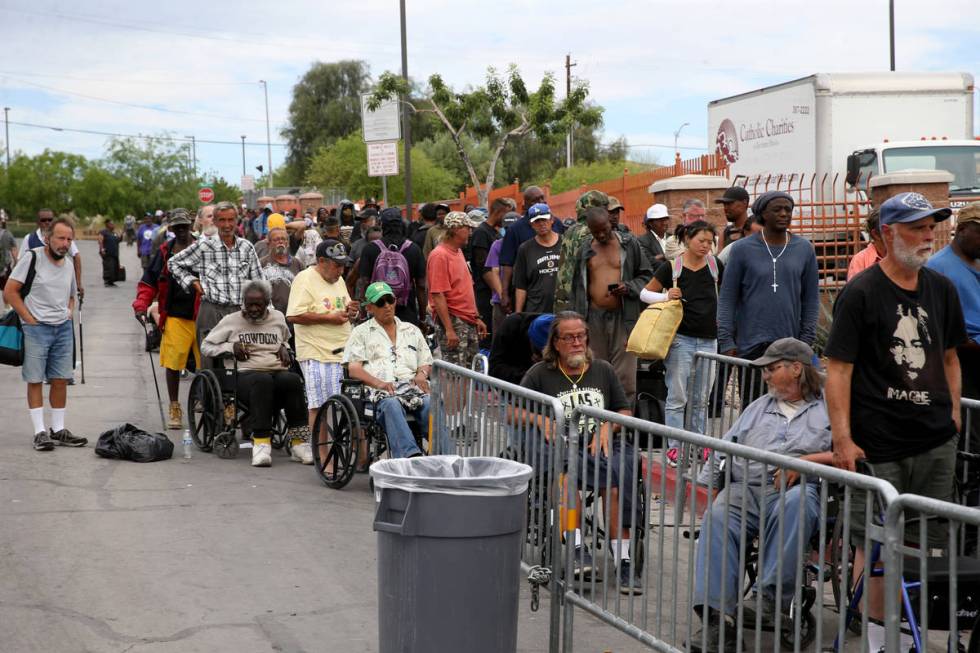 People line up for a meal at Catholic Charities on Foremaster Lane between Las Vegas Boulevard ...