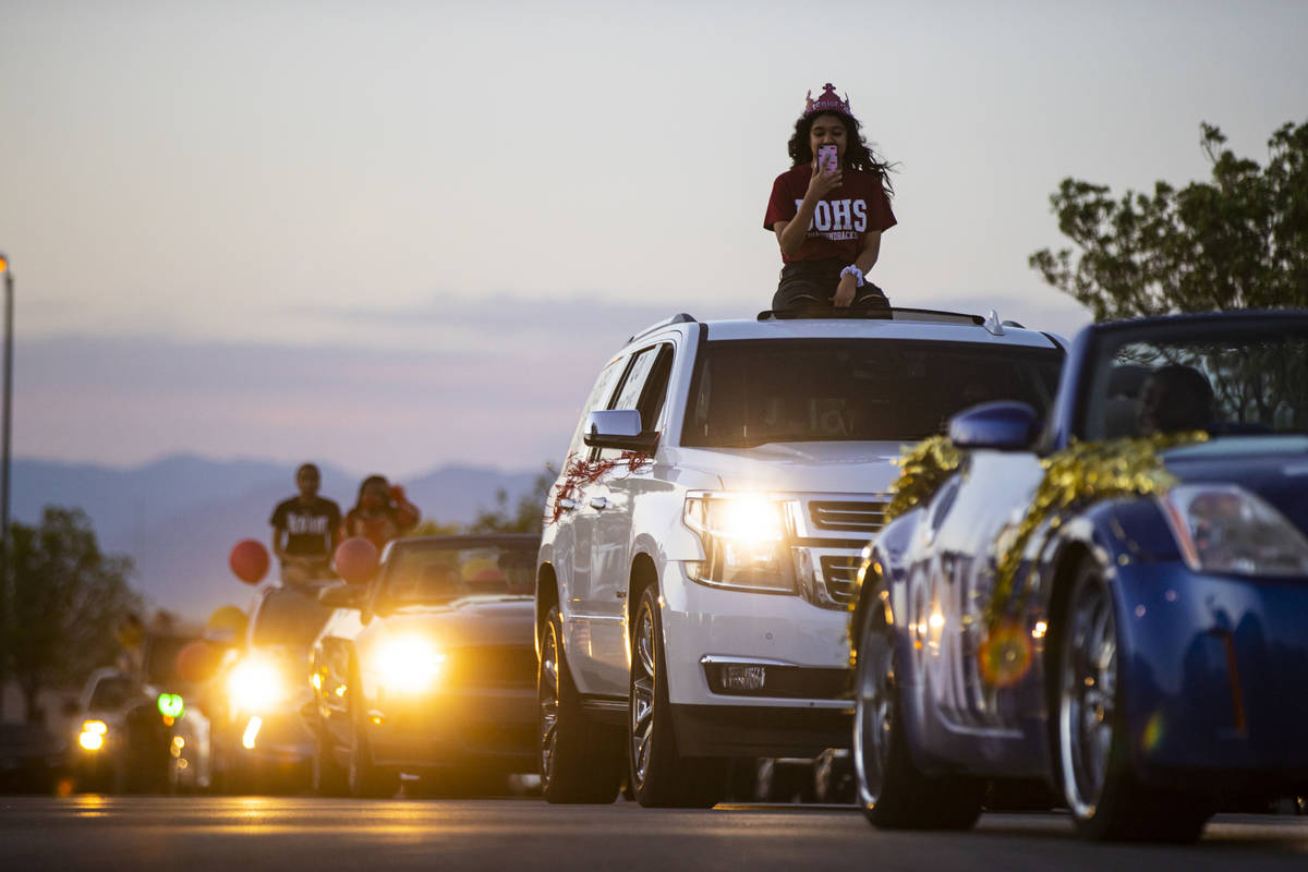 Desert Oasis High School students participate in a senior prom parade in Las Vegas on Friday, M ...