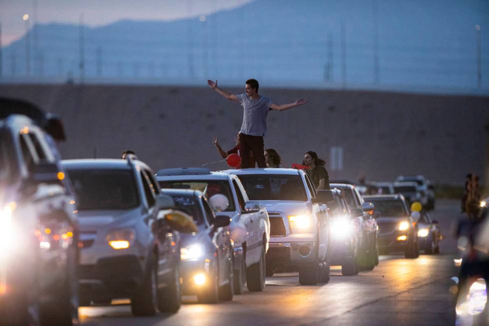 Desert Oasis High School students participate in a senior prom parade in Las Vegas on Friday, M ...