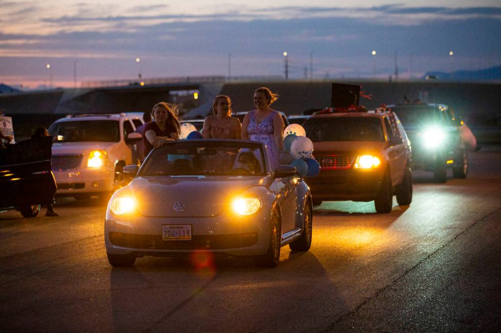 Desert Oasis High School students participate in a senior prom parade in Las Vegas on Friday, M ...