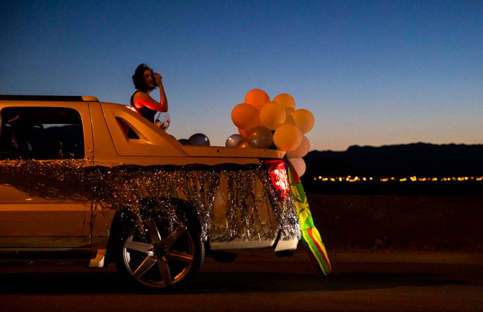 Desert Oasis High School students participate in a senior prom parade in Las Vegas on Friday, M ...