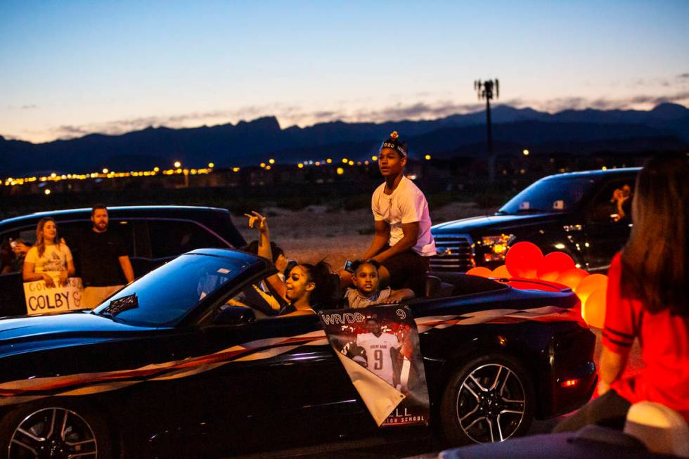 Desert Oasis High School football player Jimmy Halsell participates in a senior prom parade in ...