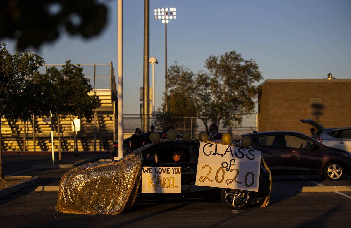 People wait for the start of the Desert Oasis High School senior prom parade in Las Vegas on Fr ...