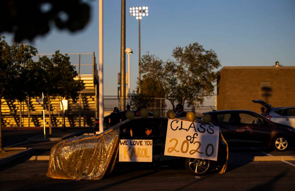 People wait for the start of the Desert Oasis High School senior prom parade in Las Vegas on Fr ...