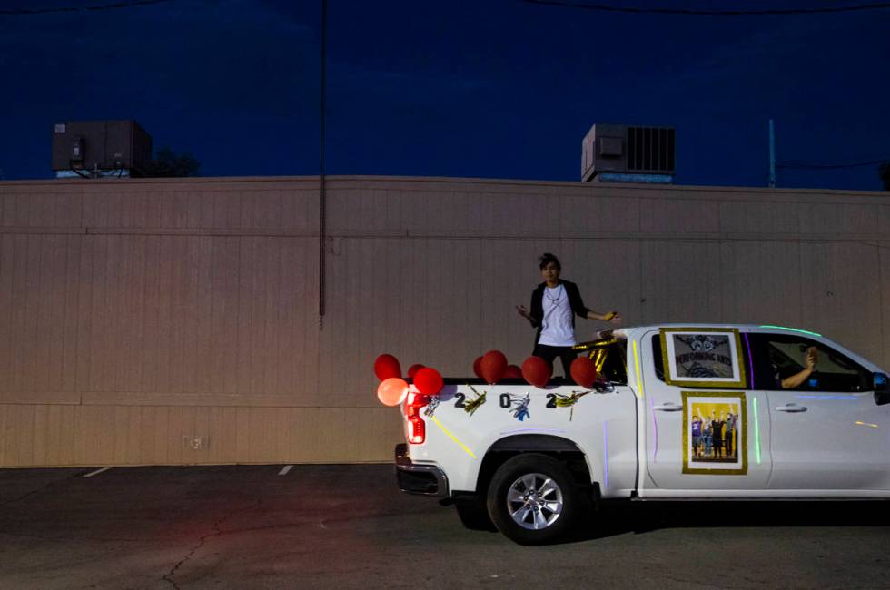 Desert Oasis High School students participate in a senior prom parade in Las Vegas on Friday, M ...