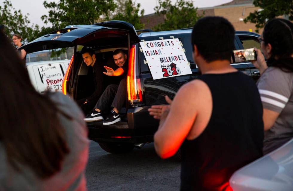 Desert Oasis High School students participate in a senior prom parade in Las Vegas on Friday, M ...