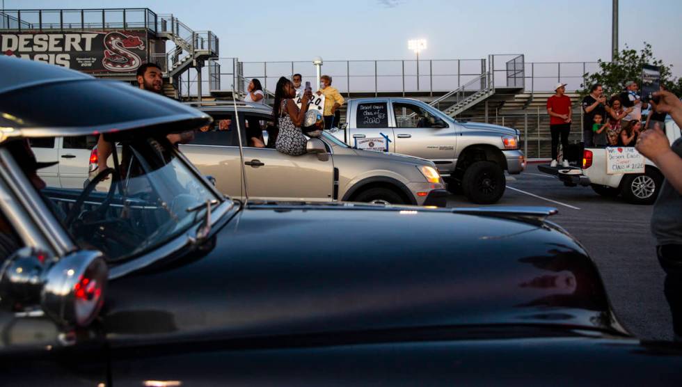 Desert Oasis High School students participate in a senior prom parade in Las Vegas on Friday, M ...