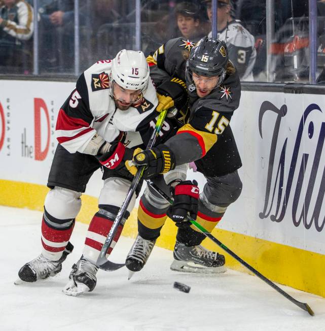 Arizona Coyotes center Brad Richardson (15, left) and Vegas Golden Knights defenseman Jon Merri ...