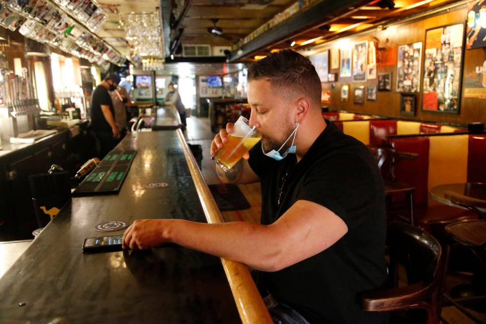 Cheers to You patron Mike Turner drinks a beer at the bar Friday, May 1, 2020, in Salt Lake Cit ...