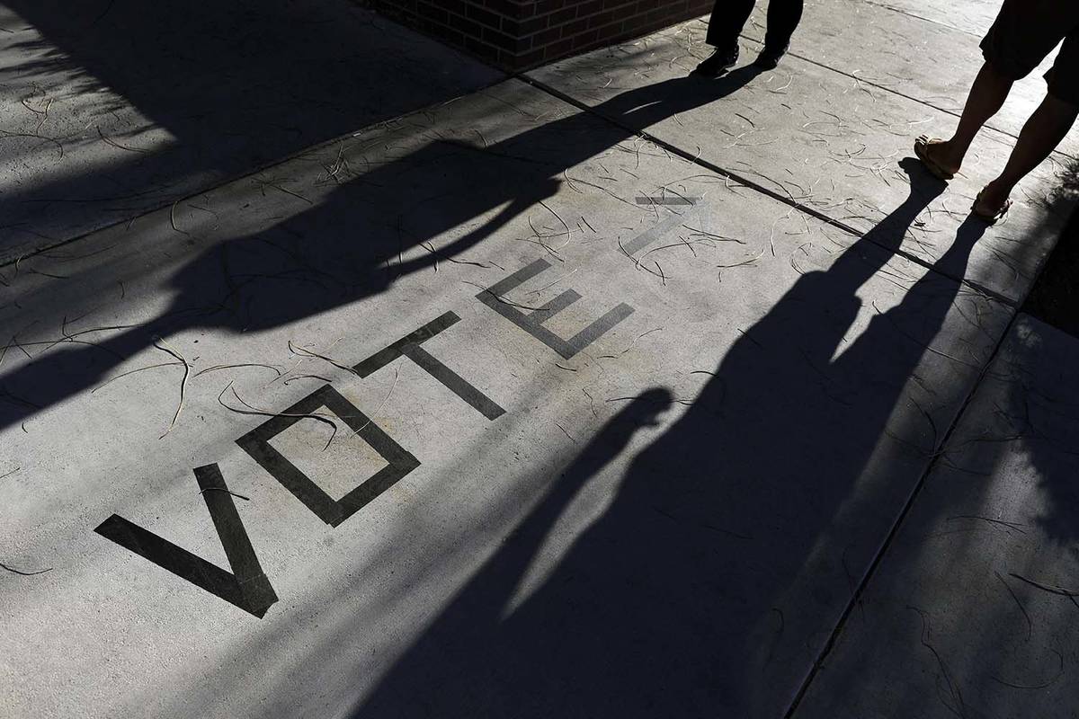 Voters head to the polls at the Enterprise Library in Las Vegas in this 2018 file photo. (AP P ...