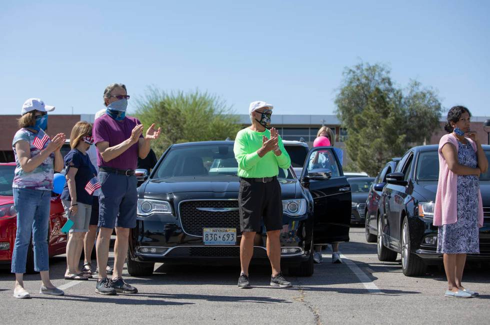 People protesting the building of the new hockey arena in Henderson cheer before getting in the ...