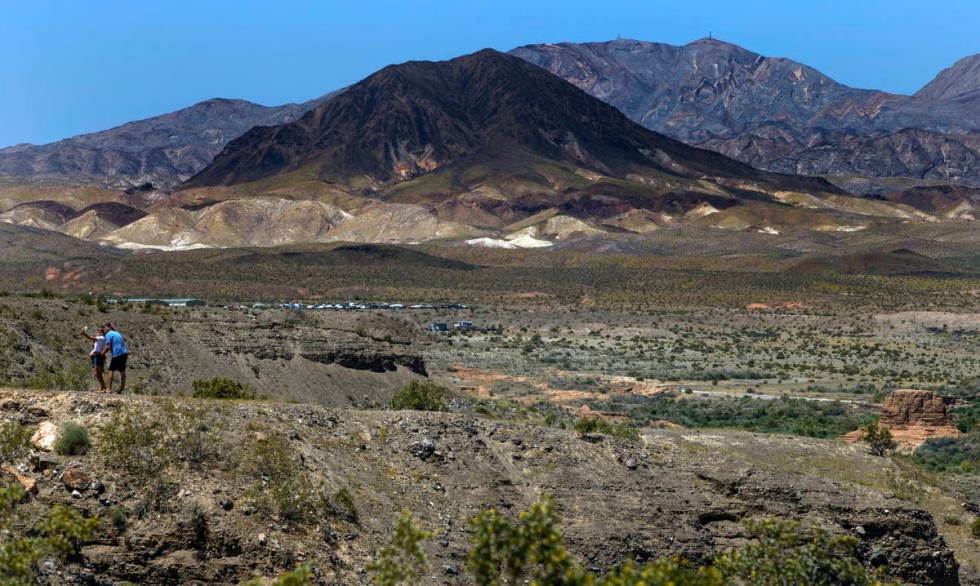 A couple takes a photo at the 33 Hole Scenic Overlook in the Lake Mead National Recreation Area ...