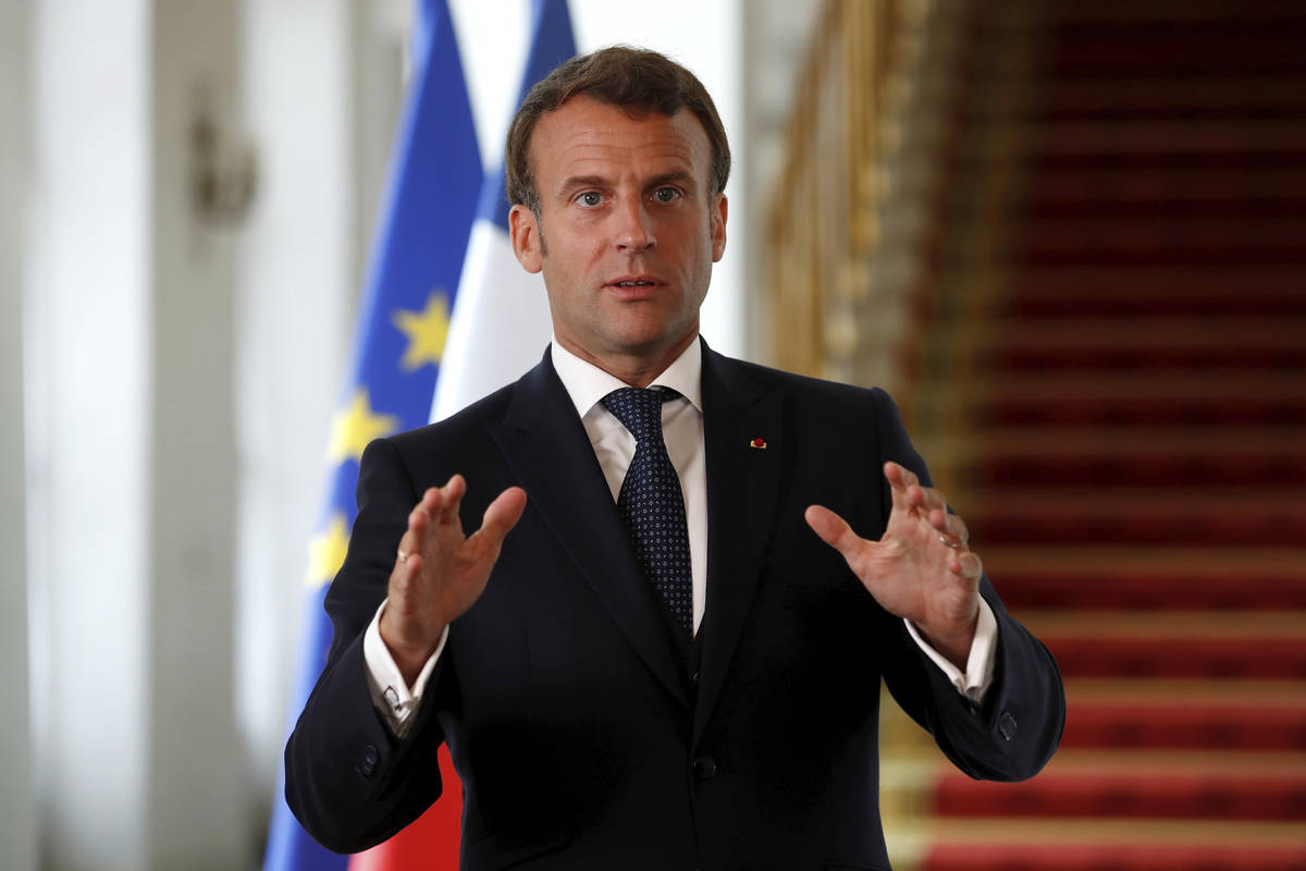 French President Emmanuel Macron speaks after a video-conference summit on vaccination at the E ...