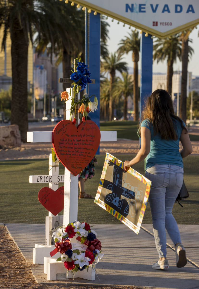 White crosses for Greg Zanis at the "Welcome to Fabulous Las Vegas" sign on Monday, M ...