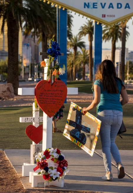 White crosses for Greg Zanis at the "Welcome to Fabulous Las Vegas" sign on Monday, M ...