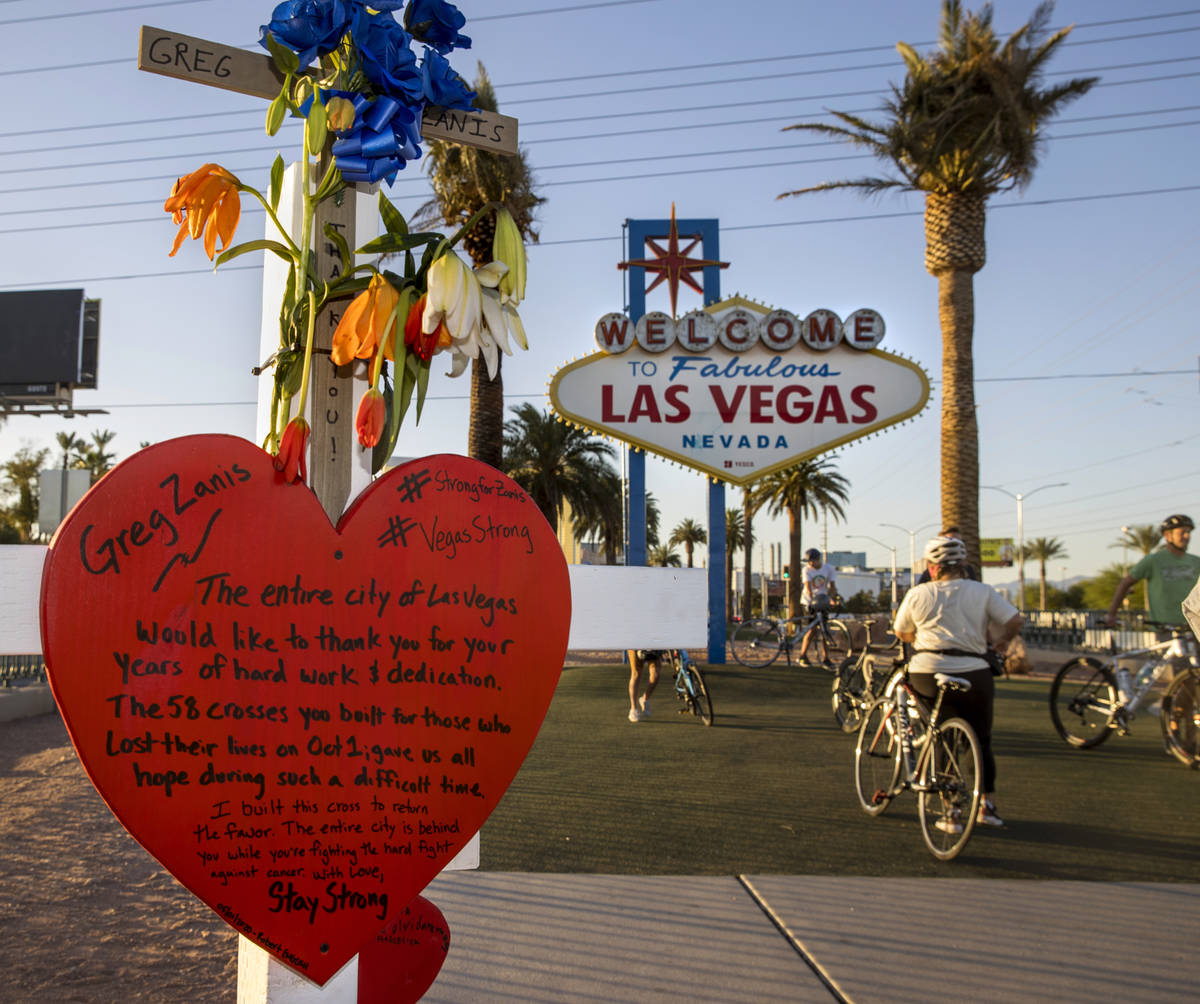 White crosses for Greg Zanis at the "Welcome to Fabulous Las Vegas" sign on Monday, M ...