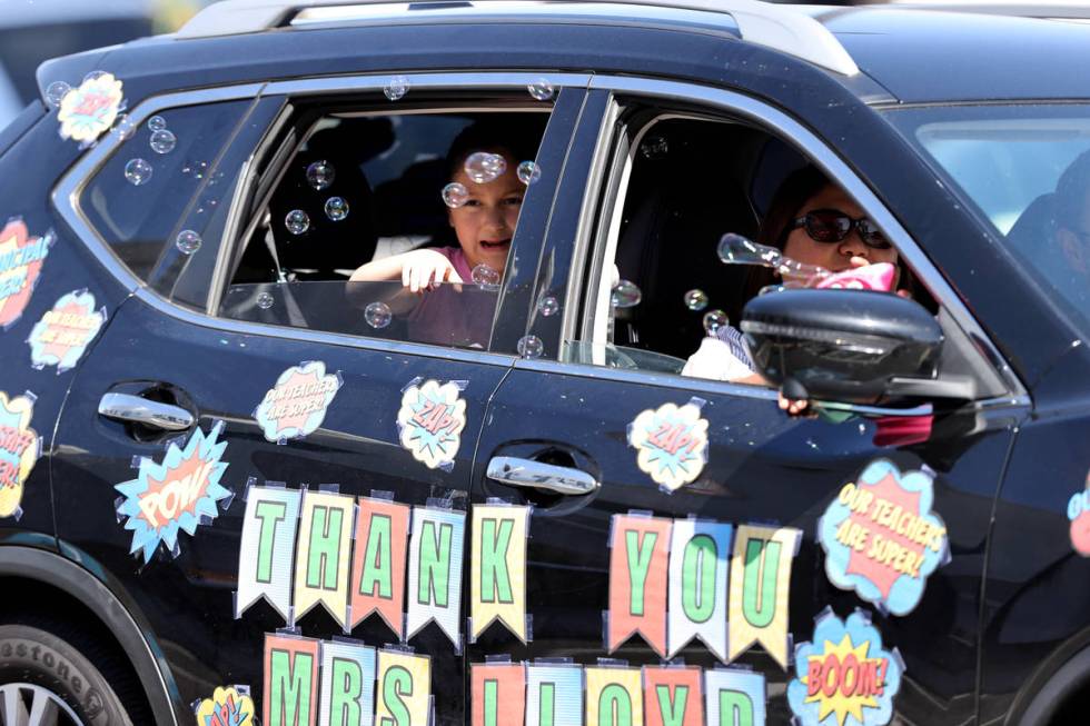 Legacy Traditional School Southwest first grader Jules Dorsett, 7, cries upon seeing her teache ...