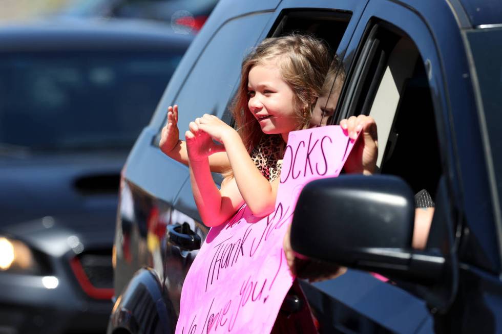 Legacy Traditional School Southwest kindergartner Aubree Van Dyke, 5, makes a heart shape for h ...