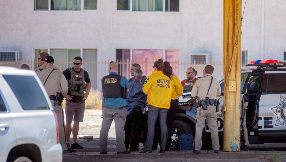 Las Vegas police investigate a downtown shooting in the 1900 block of Fremont Street in Las Veg ...