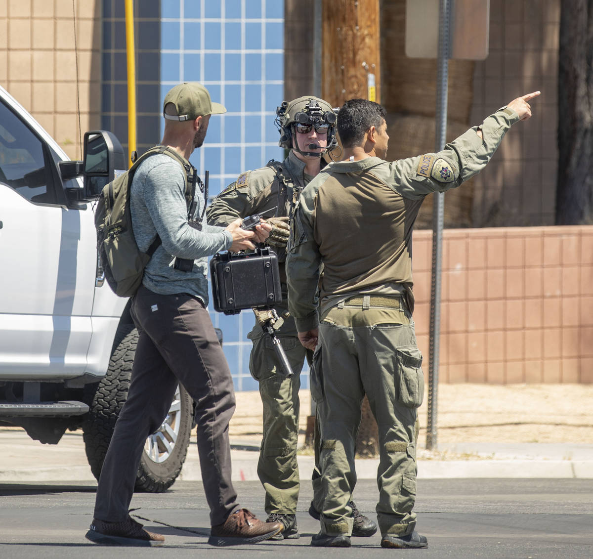 Las Vegas police investigate a downtown shooting in the 1900 block of Fremont Street in Las Veg ...