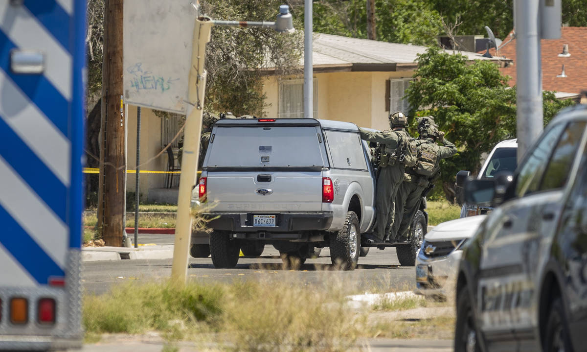 Las Vegas police investigate a downtown shooting in the 1900 block of Fremont Street in Las Veg ...