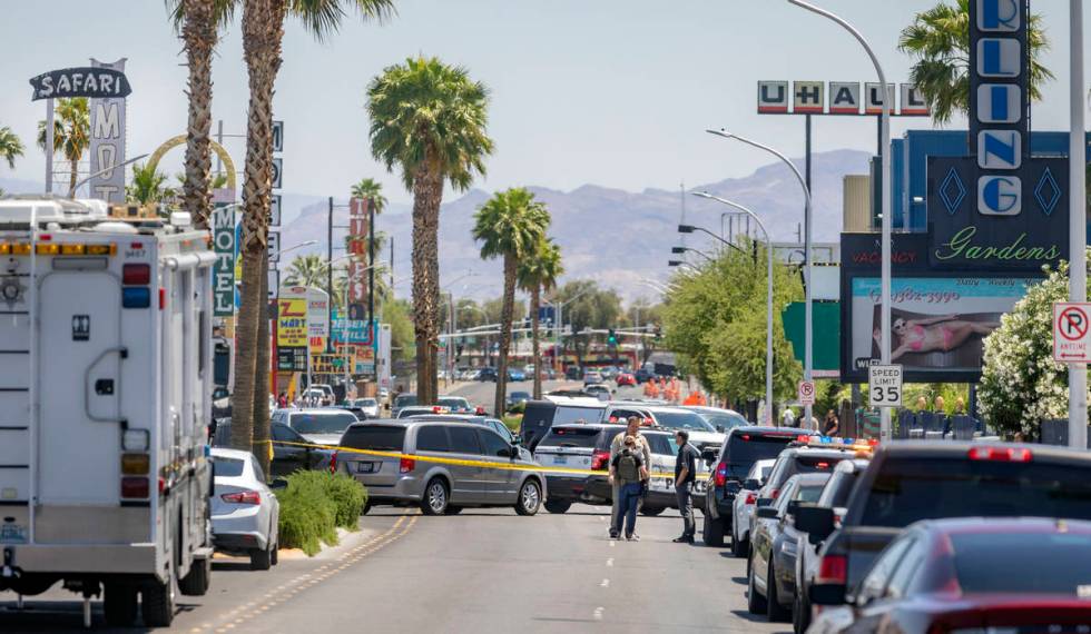 Las Vegas police investigate a downtown shooting in the 1900 block of Fremont Street in Las Veg ...