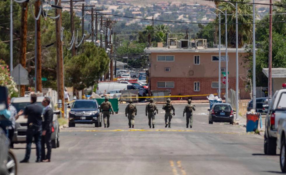 Las Vegas police investigate a downtown shooting in the 1900 block of Fremont Street in Las Veg ...