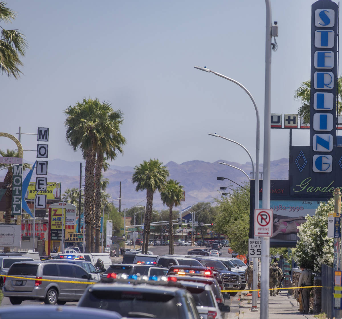 Las Vegas police investigate a downtown shooting in the 1900 block of Fremont Street in Las Veg ...