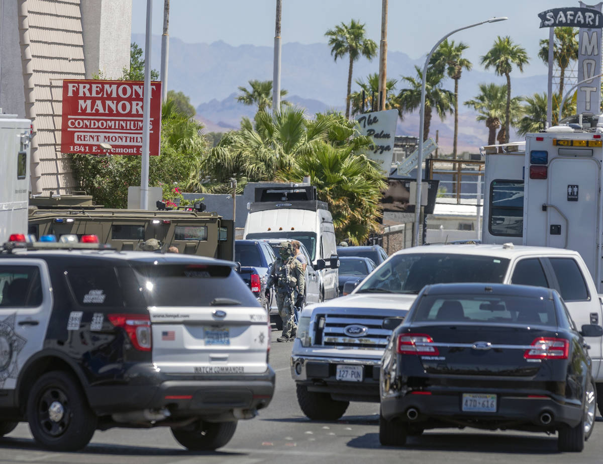 Las Vegas police investigate a downtown shooting in the 1900 block of Fremont Street in Las Veg ...