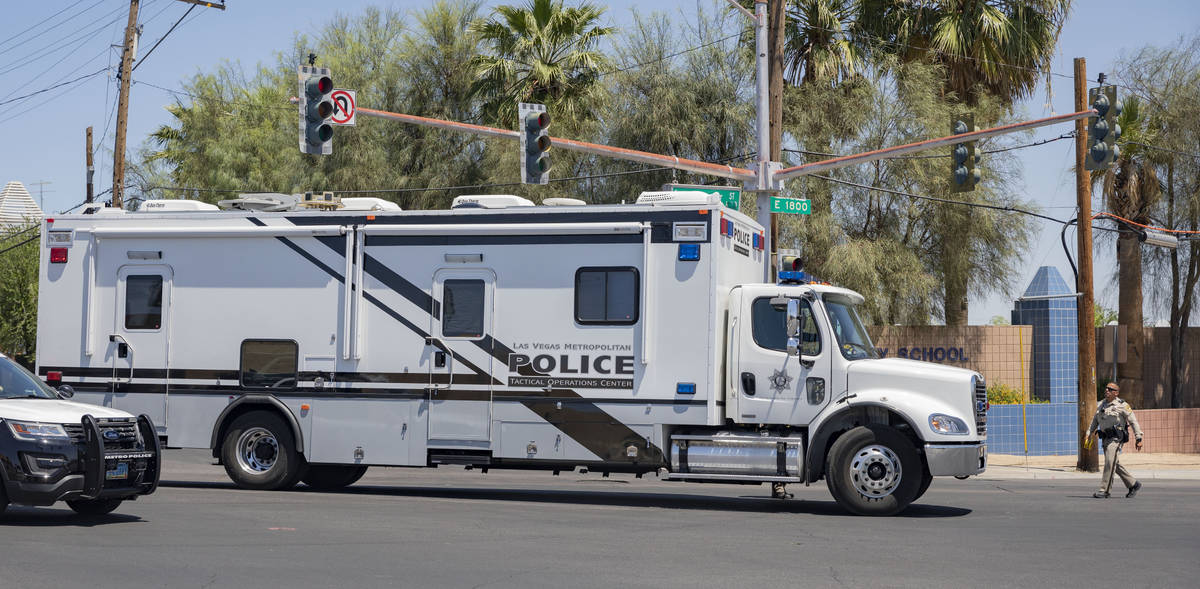 Las Vegas police investigate a downtown shooting in the 1900 block of Fremont Street in Las Veg ...