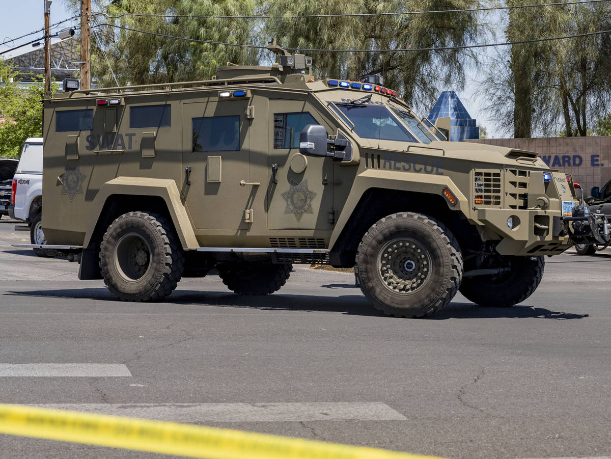 Las Vegas police investigate a downtown shooting in the 1900 block of Fremont Street in Las Veg ...