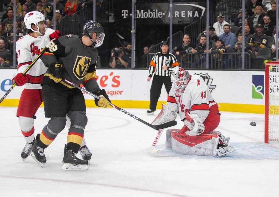 Vegas Golden Knights left wing Tomas Nosek (92) shoots on Carolina Hurricanes goaltender James ...