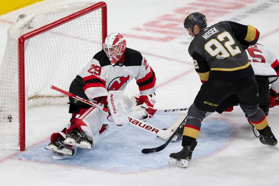 Vegas Golden Knights left wing Tomas Nosek (92) watches a shot from Vegas Golden Knights right ...