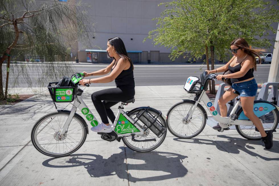 Reina Leyva, left, and Maribel Leyva, use RTC Bike Shares from the East Sahara Ave., and Las Ve ...