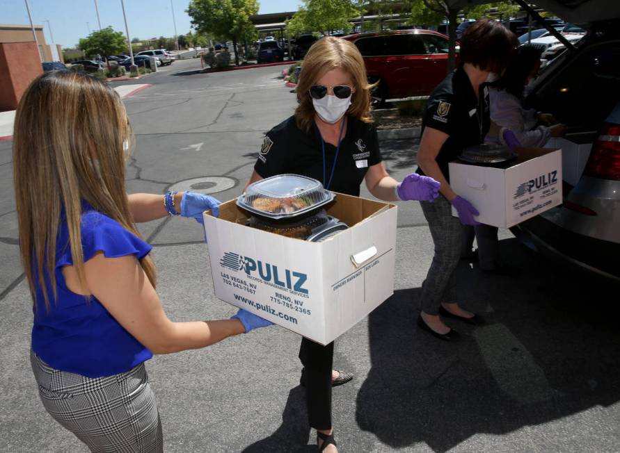 Comprehensive Cancer Centers of Nevada staff members, from left, Connie Gutierrez, office manag ...