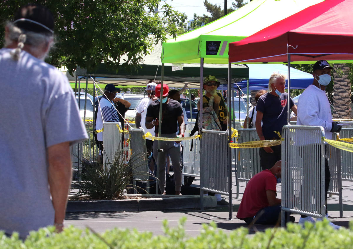 People lined up outside of the Las Vegas Metropolitan Police Department headquarters on Tuesday ...