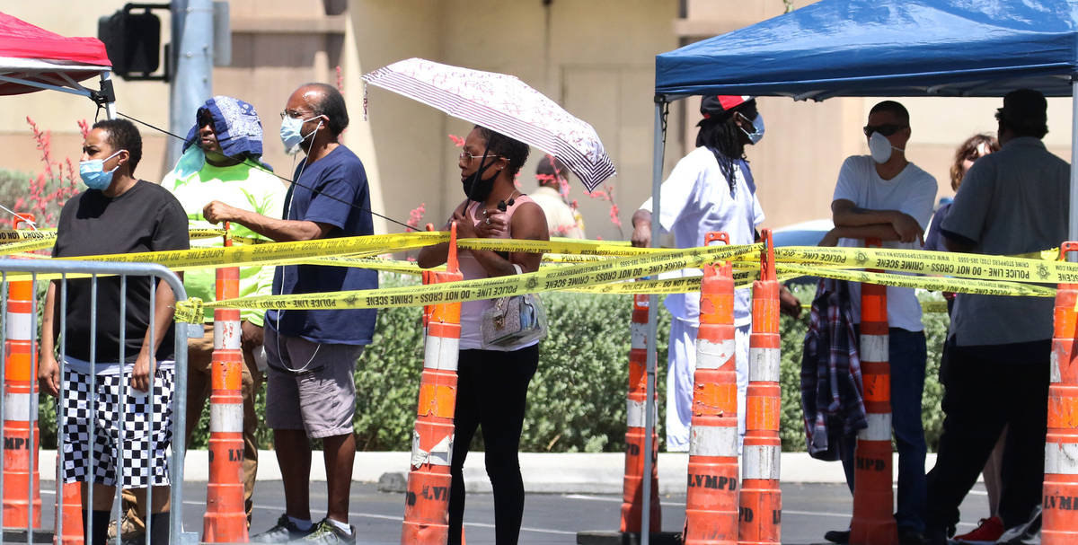 People lined up outside of the Las Vegas Metropolitan Police Department headquarters on Tuesday ...