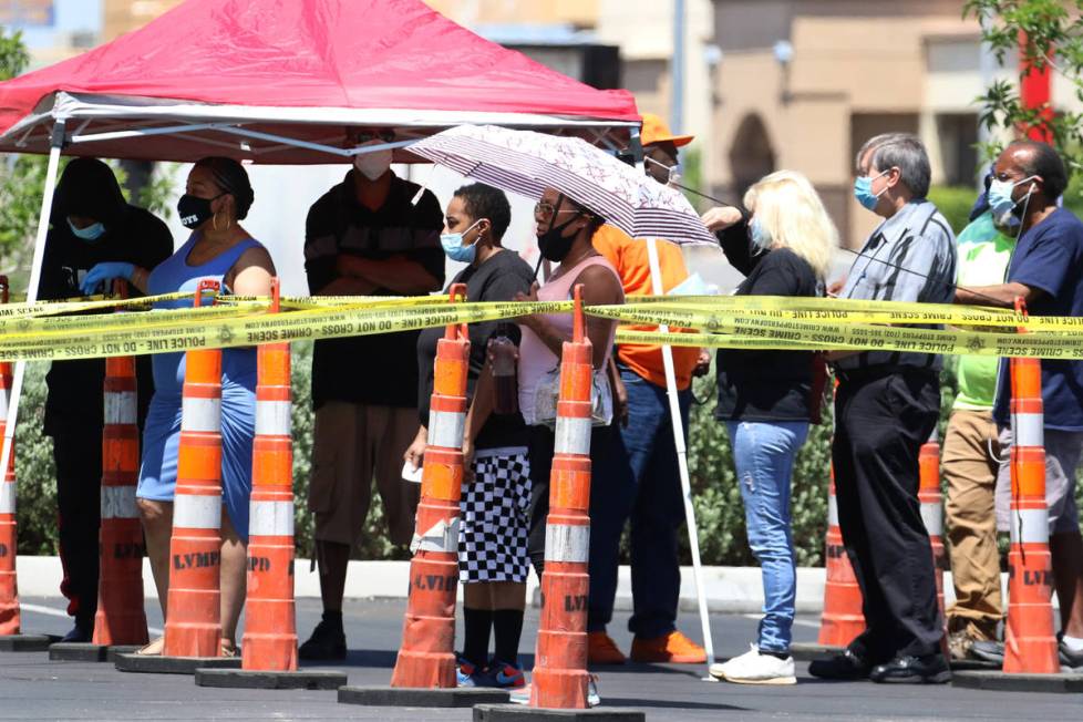 People lined up outside of the Las Vegas Metropolitan Police Department headquarters on Tuesday ...