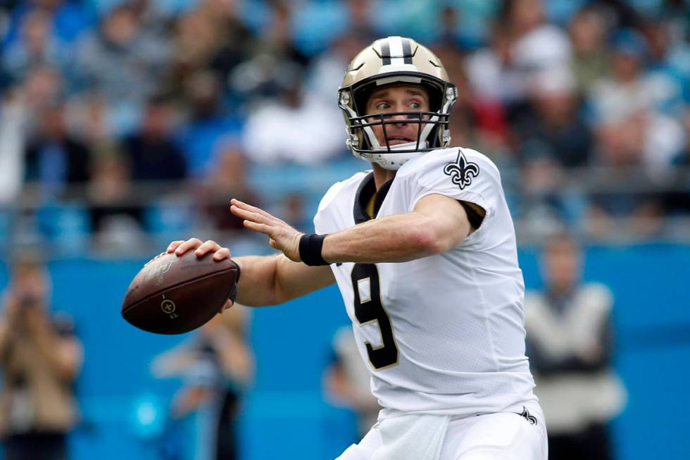 New Orleans Saints quarterback Drew Brees (9) passes against the Carolina Panthers during the f ...
