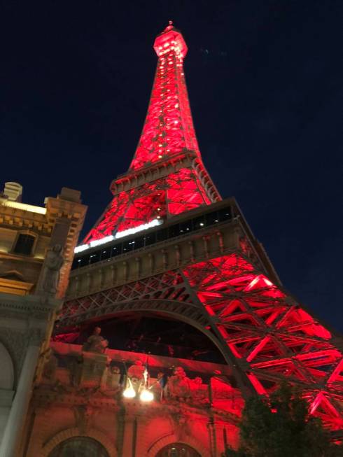 Paris Las Vegas is lighted up in red on Tuesday, May 5, 2020, in honor of National Travel and T ...