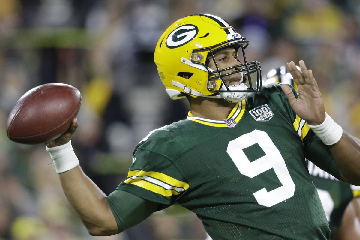 Green Bay Packers' DeShone Kizer throws during the first half of an NFL football game against t ...