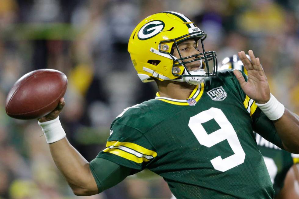 Green Bay Packers' DeShone Kizer throws during the first half of an NFL football game against t ...