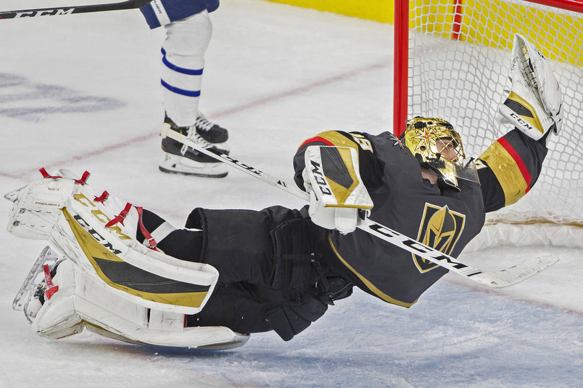 Vegas Golden Knights goaltender Marc-Andre Fleury (29) makes a diving save in the third period ...